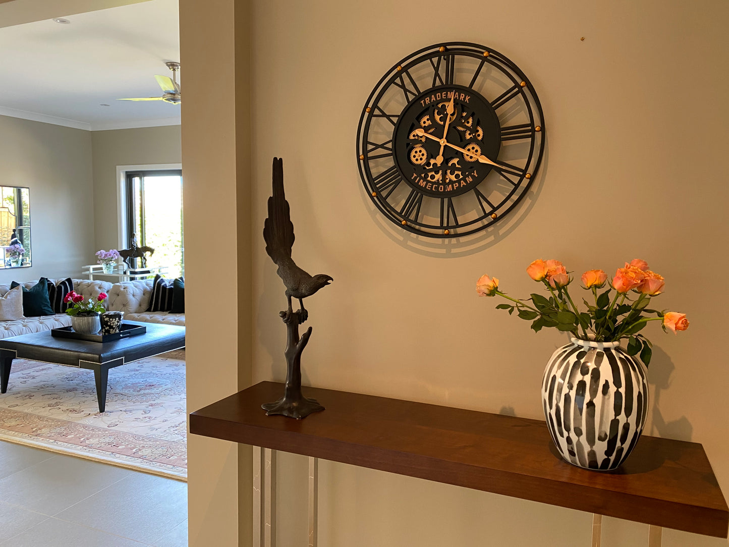 TRADEMARK 60.5 Cm Black & Gold Roman Numeral Moving Gear Wall Clock