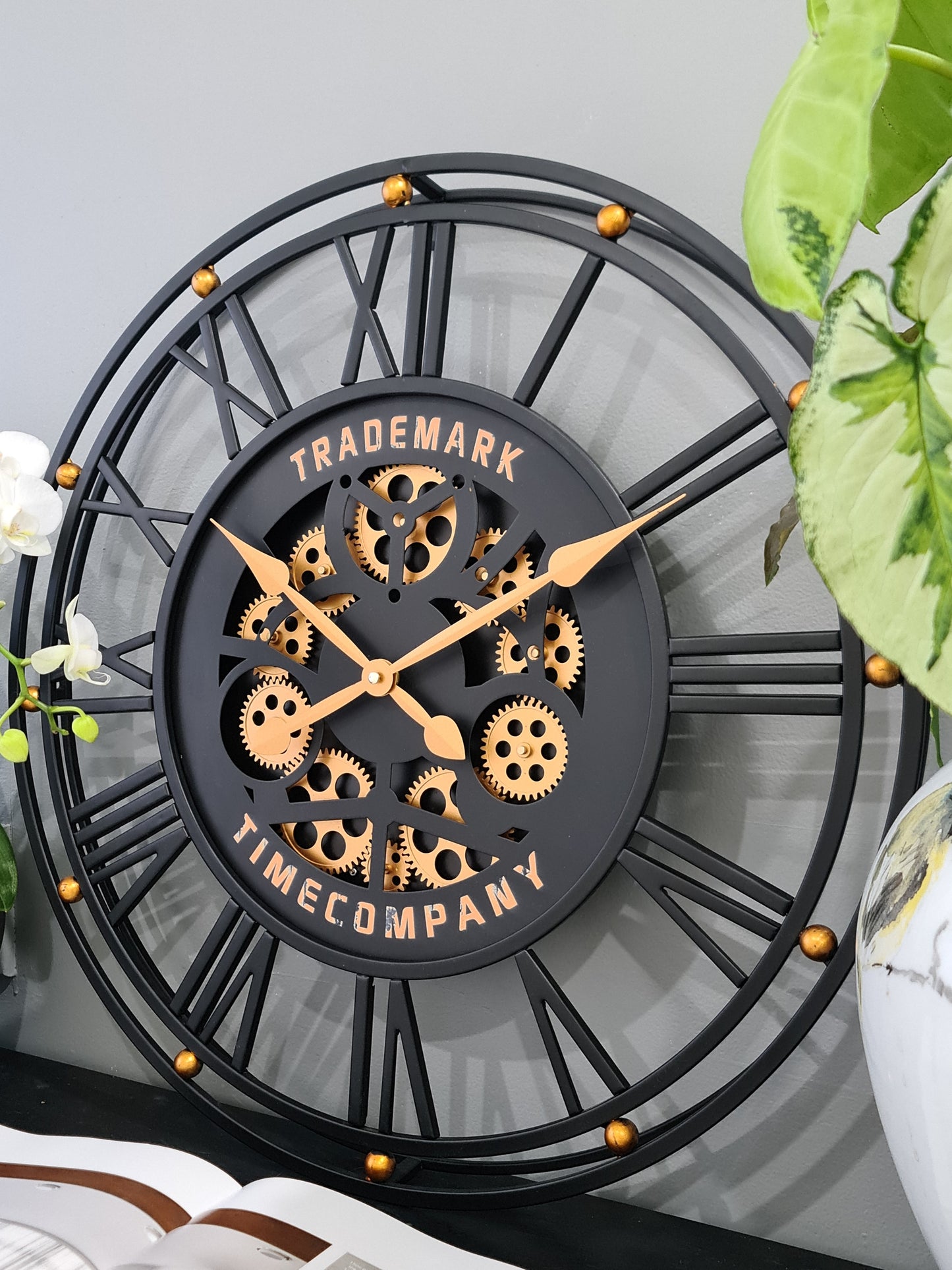 TRADEMARK 60.5 Cm Black & Gold Roman Numeral Moving Gear Wall Clock