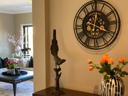 TRADEMARK 60.5 Cm Black & Gold Roman Numeral Moving Gear Wall Clock